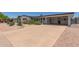 Well-maintained, single story home featuring desert landscaping, a long driveway, and a spacious carport in a quiet neighborhood at 701 N 55Th Pl, Mesa, AZ 85205