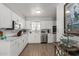 Bright kitchen featuring white cabinets, stainless steel appliances, and modern countertops at 701 N 55Th Pl, Mesa, AZ 85205