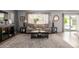 Bright living room with a comfortable sofa, stylish lamps, and a decorative rug, creating a welcoming and relaxing space at 701 N 55Th Pl, Mesa, AZ 85205