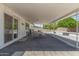 Covered patio with table and chairs, perfect for outdoor dining and relaxation at 701 N 55Th Pl, Mesa, AZ 85205