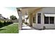 A well-maintained backyard featuring covered patio, green grass, and attractive landscaping at 7825 W Crocus Dr, Peoria, AZ 85381