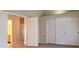Spacious bedroom featuring neutral carpet and sliding closet doors at 7825 W Crocus Dr, Peoria, AZ 85381