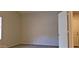 Bedroom with neutral walls, carpeted floor, closet, and views to bathroom and hall at 7825 W Crocus Dr, Peoria, AZ 85381