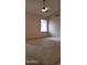 Large bedroom featuring carpet, ceiling fan, and a window providing natural light at 7825 W Crocus Dr, Peoria, AZ 85381