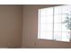 Bright bedroom featuring a window with blind allowing ample natural light at 7825 W Crocus Dr, Peoria, AZ 85381