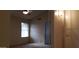 Neutral-toned bedroom with natural light, ceiling fan, and closet at 7825 W Crocus Dr, Peoria, AZ 85381