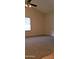 Bedroom featuring a window, neutral-colored walls, and ceiling fan at 7825 W Crocus Dr, Peoria, AZ 85381