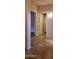 A tile floor and bright hallway are showcased in this hallway view of the home at 7825 W Crocus Dr, Peoria, AZ 85381