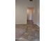 Tiled hallway that offers a seamless transition from the carpeted living spaces at 7825 W Crocus Dr, Peoria, AZ 85381