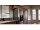 Modern kitchen featuring stainless steel refrigerator and neutral countertops at 7825 W Crocus Dr, Peoria, AZ 85381