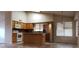 Open kitchen featuring stainless steel appliances, wood cabinets, and tile flooring at 7825 W Crocus Dr, Peoria, AZ 85381