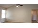 Open living area with vaulted ceiling, ceiling fan, and natural light at 7825 W Crocus Dr, Peoria, AZ 85381