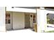 Covered front patio with a security screen door, decorative lattice and window at 7825 W Crocus Dr, Peoria, AZ 85381
