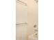 Bathroom shower with tiled walls, shower head, and a grab bar for safety and convenience at 8140 N 107Th Ave # 287, Peoria, AZ 85345