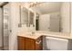 Bathroom features a wide mirror, vanity with cabinet storage, and a toilet at 8140 N 107Th Ave # 287, Peoria, AZ 85345