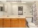 Bathroom featuring a double sink vanity and large mirror at 8140 N 107Th Ave # 287, Peoria, AZ 85345