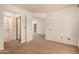 Spacious carpeted bedroom with open doorway and closet providing ample space and storage at 8140 N 107Th Ave # 287, Peoria, AZ 85345
