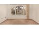 Carpeted bedroom featuring a large window and neutral walls for a calming atmosphere at 8140 N 107Th Ave # 287, Peoria, AZ 85345