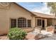 Charming single-story home featuring a landscaped front yard with desert landscaping, textured stucco, and a covered entryway at 8140 N 107Th Ave # 287, Peoria, AZ 85345