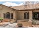 Charming single-story home featuring a landscaped front yard with desert landscaping, textured stucco, and a covered entryway at 8140 N 107Th Ave # 287, Peoria, AZ 85345