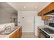 Functional kitchen with matching cabinets and countertops, neutral tile floors, and appliances at 8140 N 107Th Ave # 287, Peoria, AZ 85345
