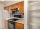 Bright kitchen features wood cabinets, a white refrigerator, and a stylish backsplash at 8140 N 107Th Ave # 287, Peoria, AZ 85345