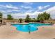 Community pool featuring lounge chairs and desert landscaping at 8140 N 107Th Ave # 287, Peoria, AZ 85345
