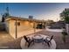 Outdoor living space with firepit, patio, landscaping, and view of the pool at 8408 E Rancho Vista Dr, Scottsdale, AZ 85251