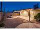 Backyard features a concrete patio, gravel landscaping, and a fire pit with seating at 8408 E Rancho Vista Dr, Scottsdale, AZ 85251