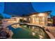 Backyard boasts a pool, firepit, and covered patio, perfect for outdoor entertaining at 8408 E Rancho Vista Dr, Scottsdale, AZ 85251