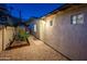 Side yard with gravel, garden box and exterior building entrance at 8408 E Rancho Vista Dr, Scottsdale, AZ 85251