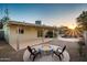 Backyard featuring a gas fire pit and pool, perfect for entertaining at 8408 E Rancho Vista Dr, Scottsdale, AZ 85251