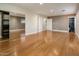 A spacious bedroom showcasing hardwood floors, bright windows, and a walk-in closet at 8408 E Rancho Vista Dr, Scottsdale, AZ 85251
