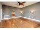 Spacious main bedroom with ceiling fan and hardwood flooring, featuring an ensuite bathroom and natural light at 8408 E Rancho Vista Dr, Scottsdale, AZ 85251
