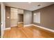 A neutral colored bedroom features hardwood flooring, and large sliding mirrored closet doors at 8408 E Rancho Vista Dr, Scottsdale, AZ 85251
