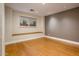 An empty bedroom with hardwood floors, neutral paint, a window, and recessed lights at 8408 E Rancho Vista Dr, Scottsdale, AZ 85251