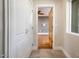 Hallway with closet featuring a view into an adjacent bedroom at 8408 E Rancho Vista Dr, Scottsdale, AZ 85251