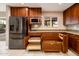 Gourmet kitchen features stainless steel appliances, custom cabinets with functional pull out shelving and soft close drawers at 8408 E Rancho Vista Dr, Scottsdale, AZ 85251