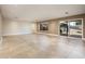Spacious living room featuring tile flooring, recessed lighting, and access to the backyard through sliding glass doors at 8408 E Rancho Vista Dr, Scottsdale, AZ 85251