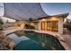 Inviting backyard pool and patio area with sail shade at 8408 E Rancho Vista Dr, Scottsdale, AZ 85251