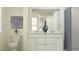 Bathroom with a double vanity, a large mirror, and a shower/tub combo at 9550 W Catalina Dr, Phoenix, AZ 85037