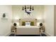 Themed bedroom with full bed, nightstands with lamps, and colorful wallpaper at 9550 W Catalina Dr, Phoenix, AZ 85037