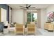 Modern living room with comfortable seating and access to an outdoor patio at 9550 W Catalina Dr, Phoenix, AZ 85037