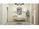 Home office featuring large mirror, a desk, and soft lighting at 9550 W Catalina Dr, Phoenix, AZ 85037