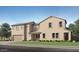 A tan, two-story home boasts a well-maintained yard and a classic architectural style at 10105 E Ulysses Ave, Mesa, AZ 85212
