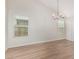 Bright dining room with updated light fixture and natural light at 11021 N 55Th Dr, Glendale, AZ 85304
