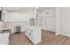 Well-lit kitchen featuring white cabinets, stainless steel appliances, and a center island at 11021 N 55Th Dr, Glendale, AZ 85304