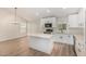 Modern kitchen with white cabinets, stainless steel appliances and a center island at 11021 N 55Th Dr, Glendale, AZ 85304