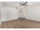 Spacious open floor plan with hardwood floors and a bright front door at 11021 N 55Th Dr, Glendale, AZ 85304