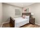Bright bedroom featuring wood floors, a window, and a wooden bed frame at 1114 N Leland Ct, Gilbert, AZ 85233